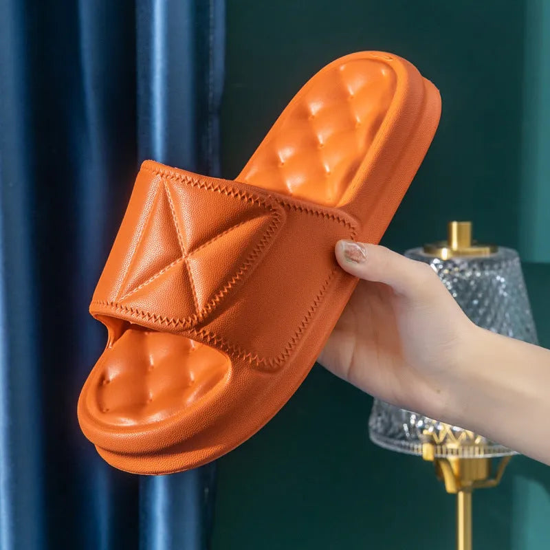 Pair of soft EVA bathroom slippers with a thick non-slip sole, shown in a selection of colours.