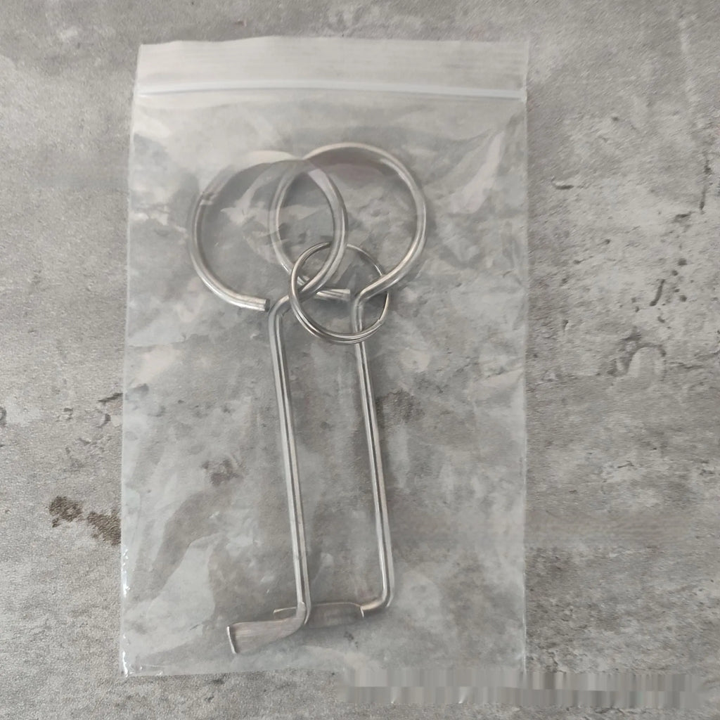 Two alloy steel wrench tools from a portable set for universal household and automotive use.