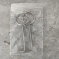 Two alloy steel wrench tools from a portable set for universal household and automotive use.