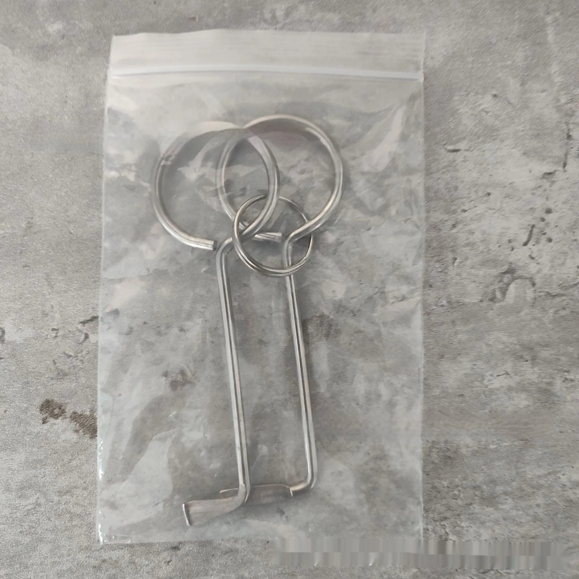 Two alloy steel wrench tools from a portable set for universal household and automotive use.