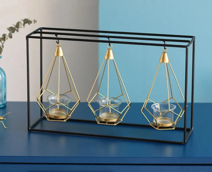 Set of six Nordic iron candle holders in various styles for block candles on a wooden shelf