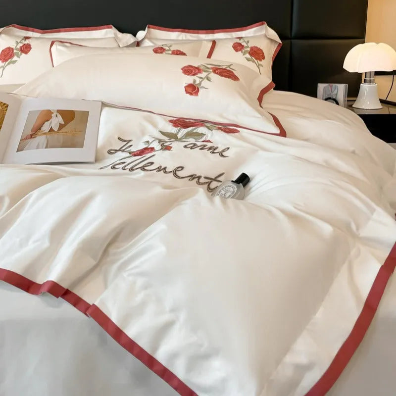 Cotton four-piece bedding set in solid colour with embroidery, includes quilt cover, bed sheet, and pillowcases