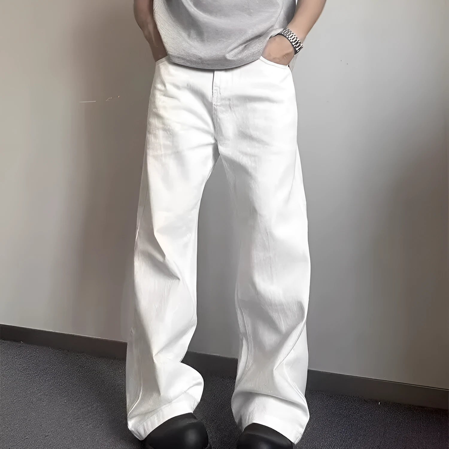 Men's white straight-leg jeans with loose fit and mid-waist cut