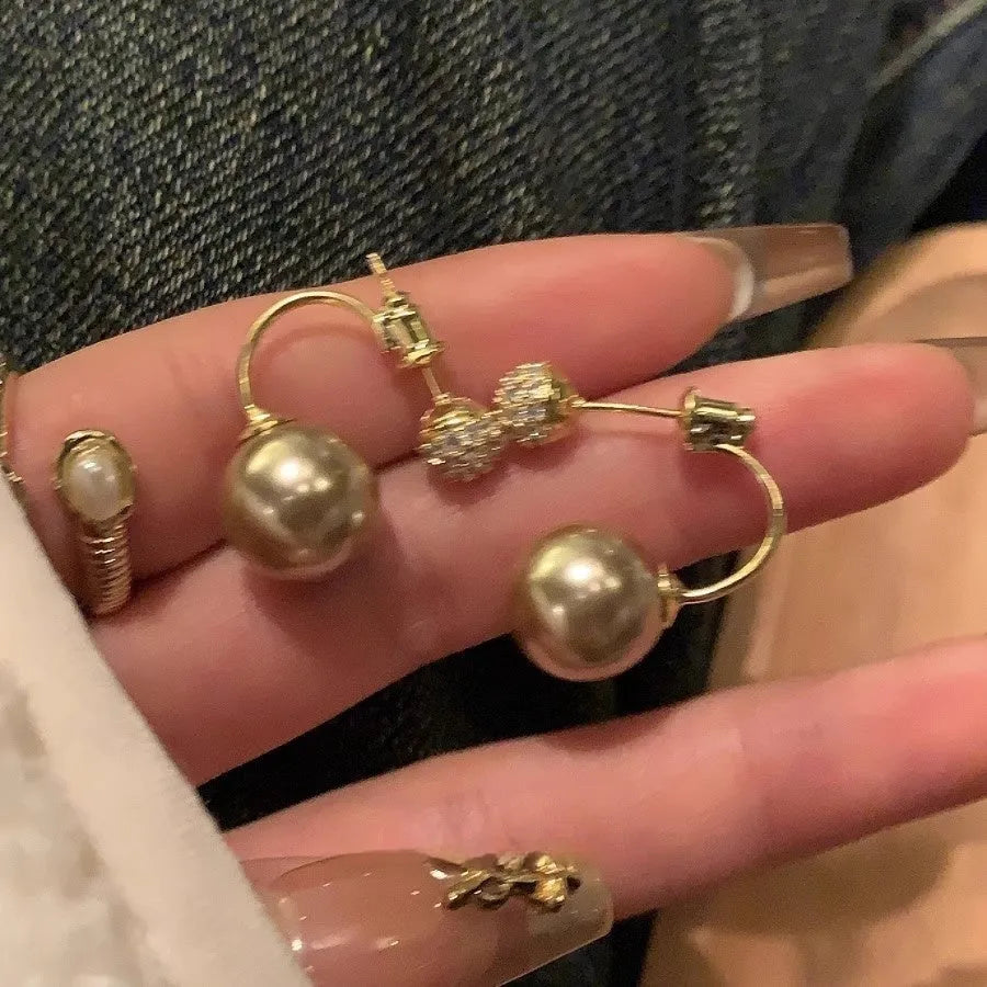 Geometric pearl stud earrings in gold electroplated copper with hanging-back design for women