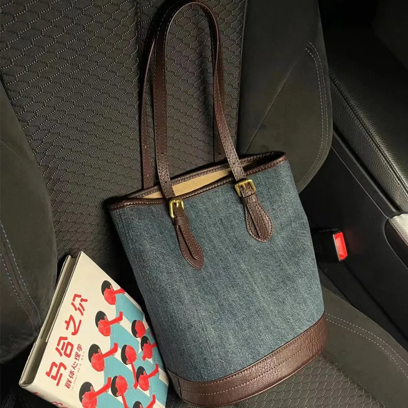 Denim patchwork one-shoulder bucket handbag showing 23x27x16cm dimensions and retro design