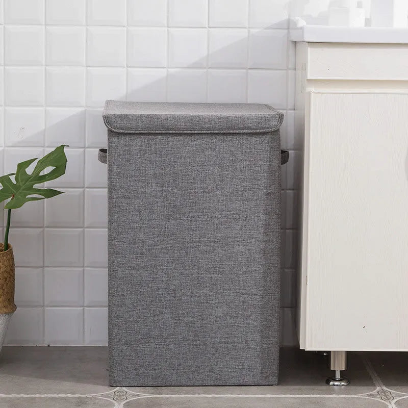 Foldable cotton linen storage basket in grey colour showing three-dimensional shape.