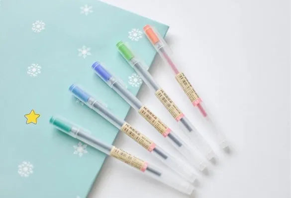 Muji 12 piece gel pen set with 0.5mm fine nibs showing blue pen barrels.