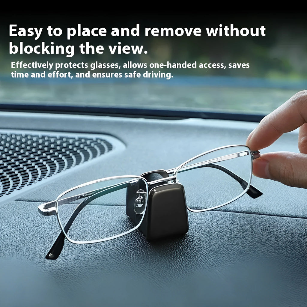 Zinc alloy and leather car dashboard clip for holding sunglasses, shown in green.