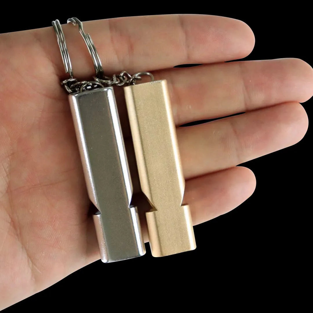 Silver and gold aluminium alloy double hole outdoor survival whistle.