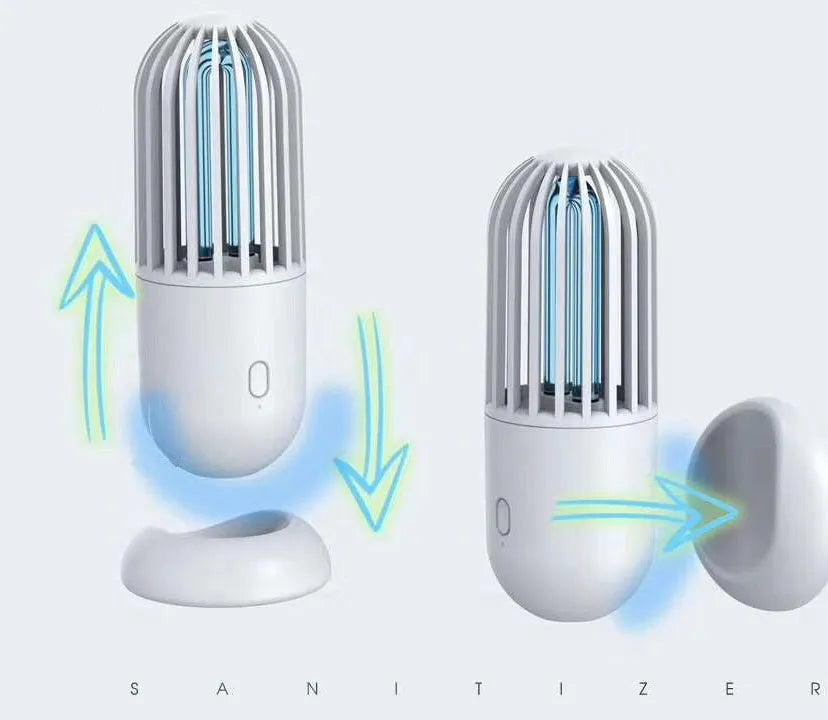 Portable capsule-shaped UVC disinfection lamp in black, showing compact size.