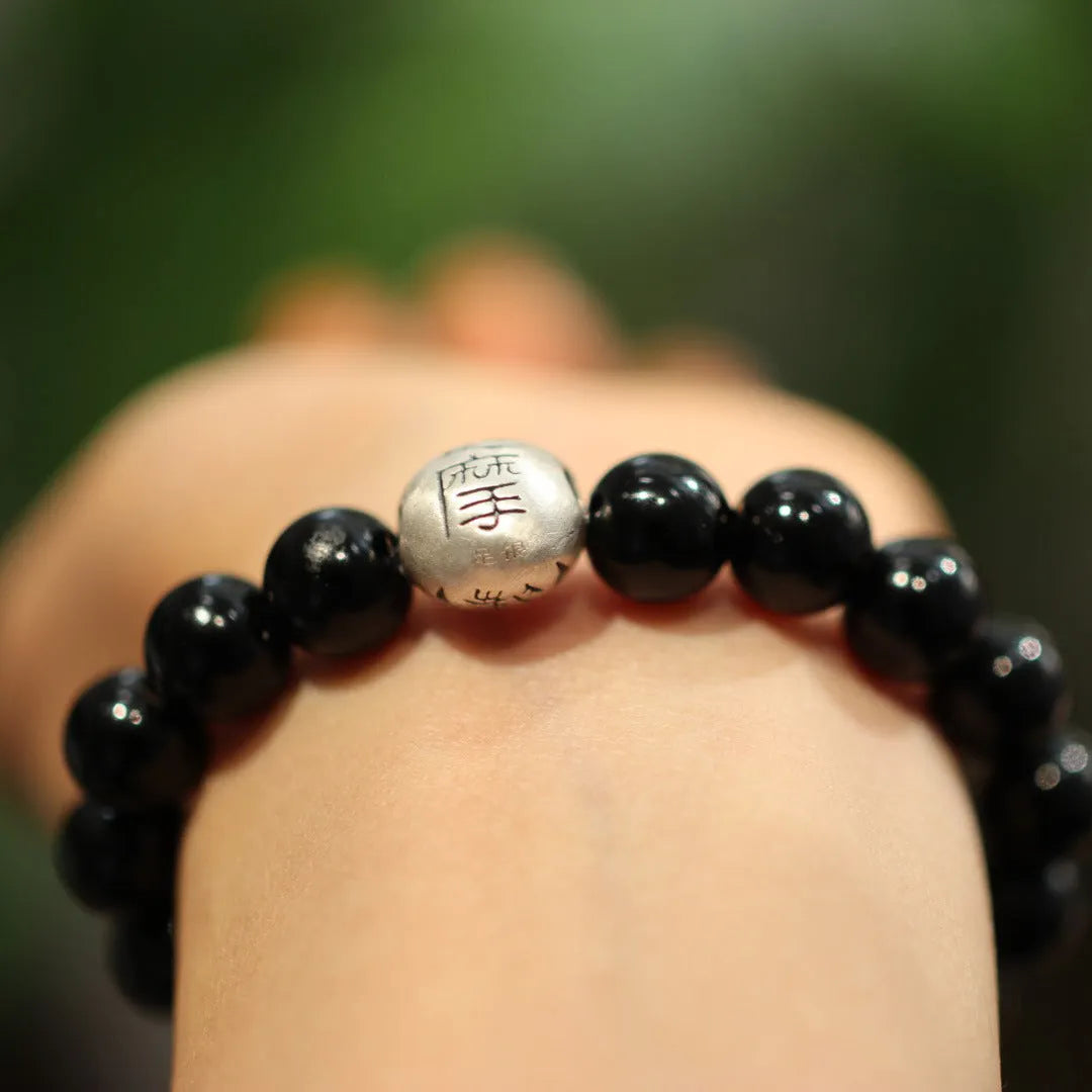 Black agate bracelet with 10mm beads and sterling silver components in Chinese style design