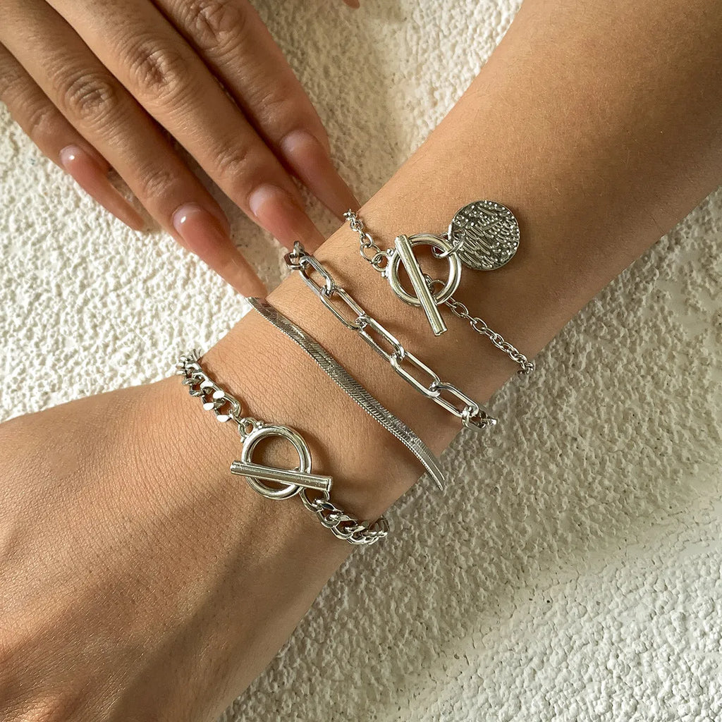 Set of 4 metal chain bracelets in gold or silver with snake bone and hollow chain designs