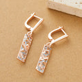 A pair of rectangular two-tone hollow stud earrings with a geometric design and picture-style colour finish.