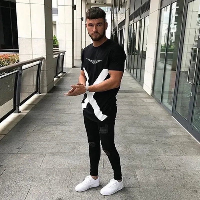 Black cotton sports t-shirt with slim fit, round collar, short sleeves and geometric print applied by hot stamping