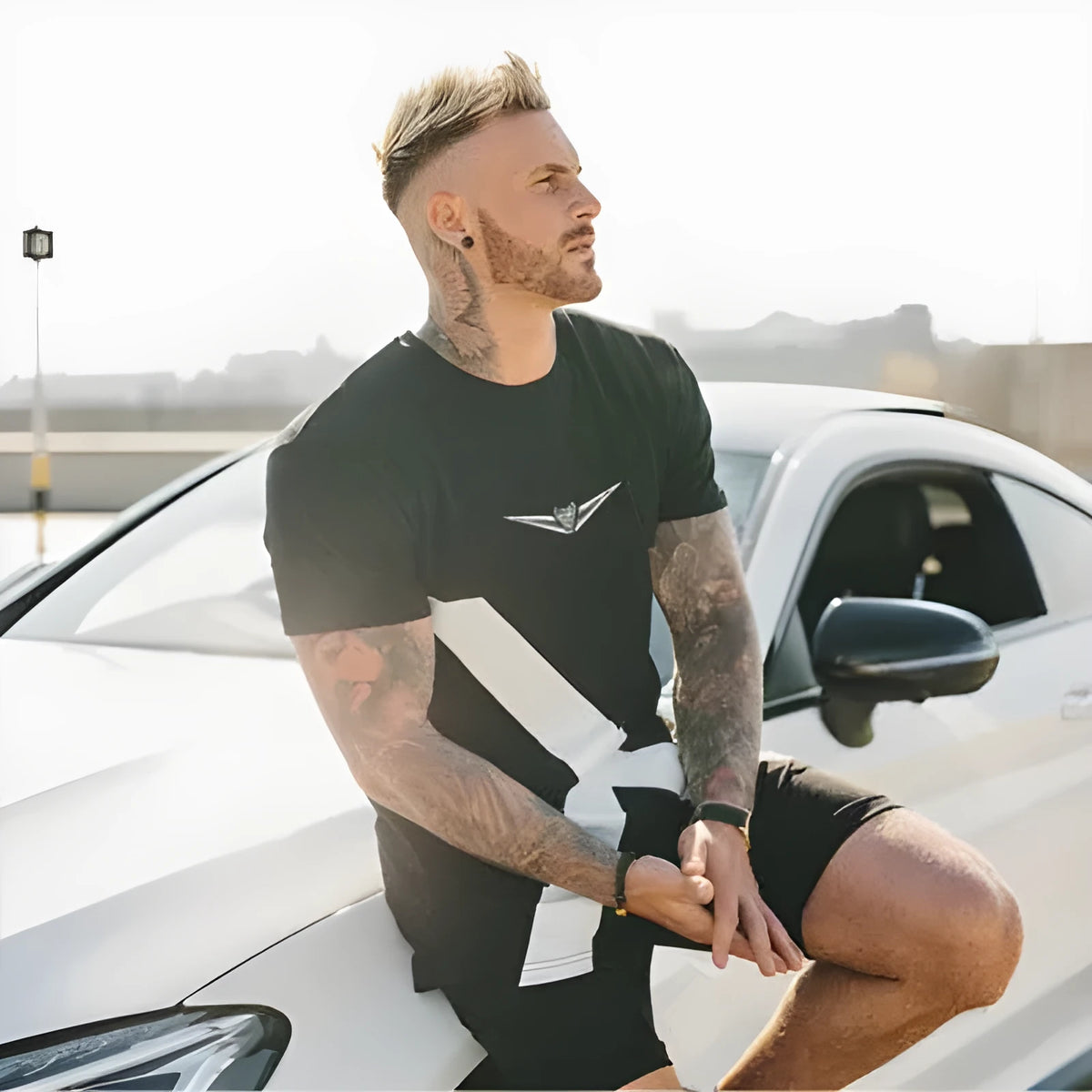 Black cotton sports t-shirt with slim fit, round collar, short sleeves and geometric print applied by hot stamping