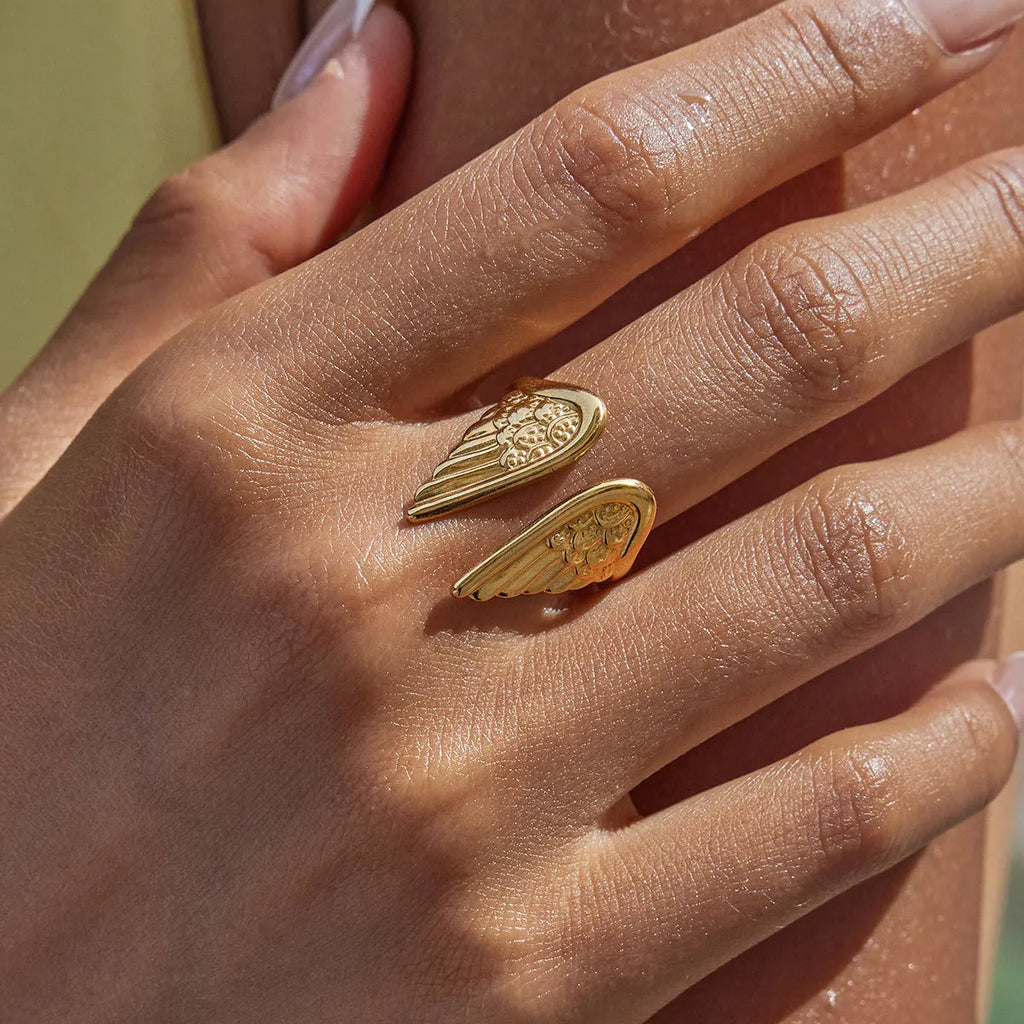 Stainless steel wings ring with adjustable opening in gold tone electroplated finish