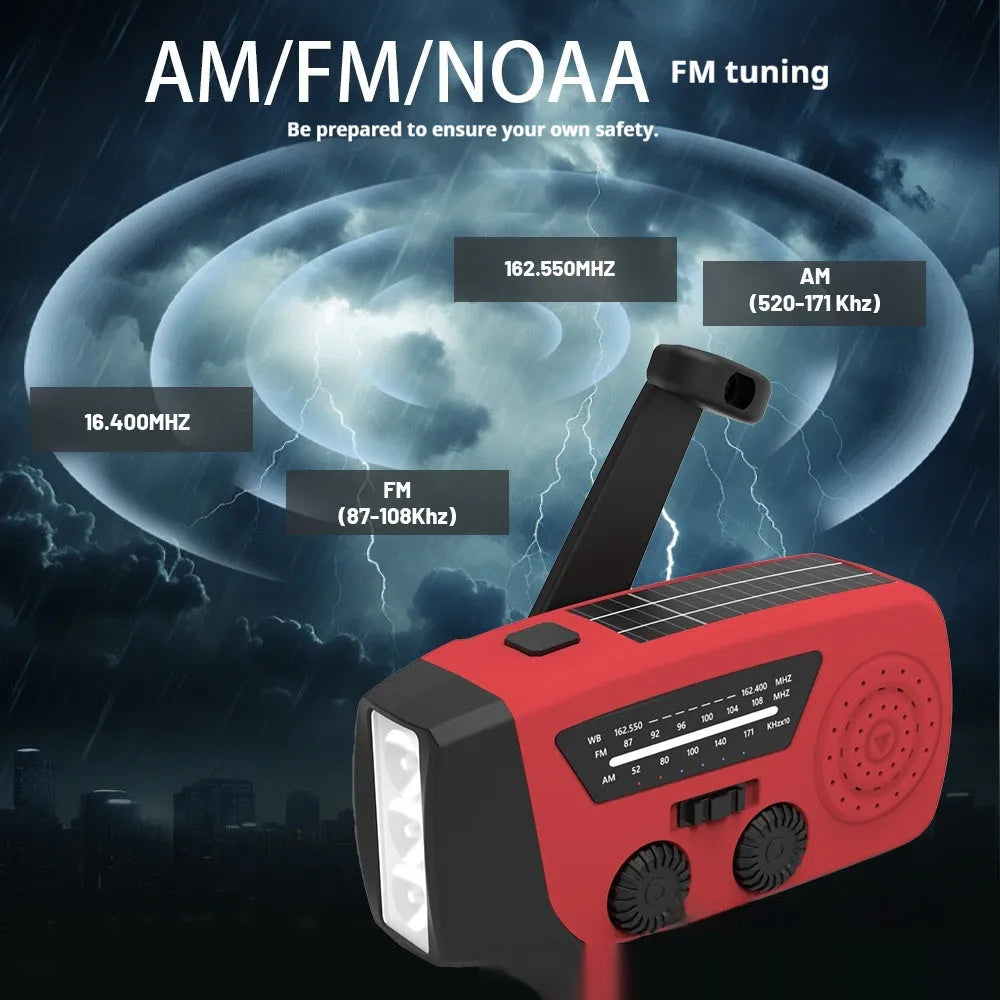 Red rechargeable hand-held radio with emergency torch, USB port, speaker, and wrist strap.