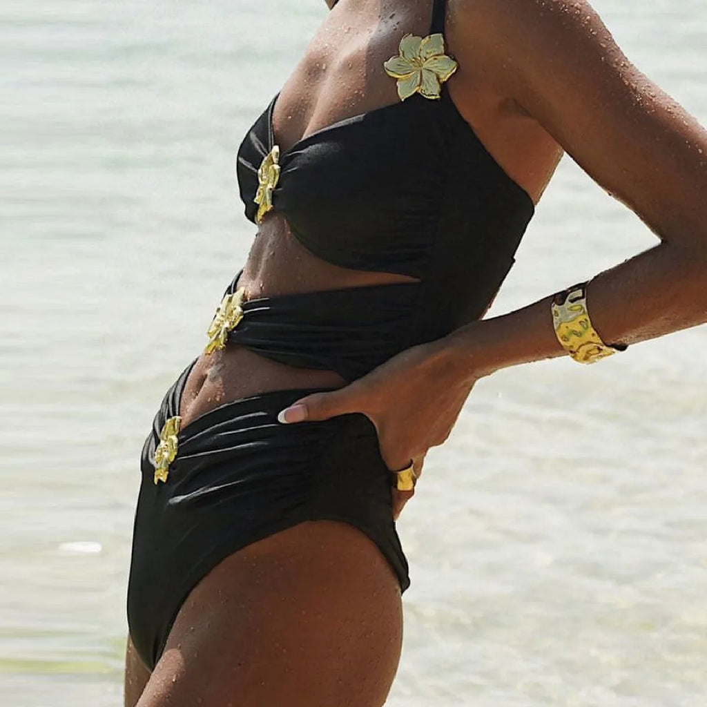Women's solid colour one-piece swimsuit with high waist and hollow-out tube top, paired with a matching short skirt.