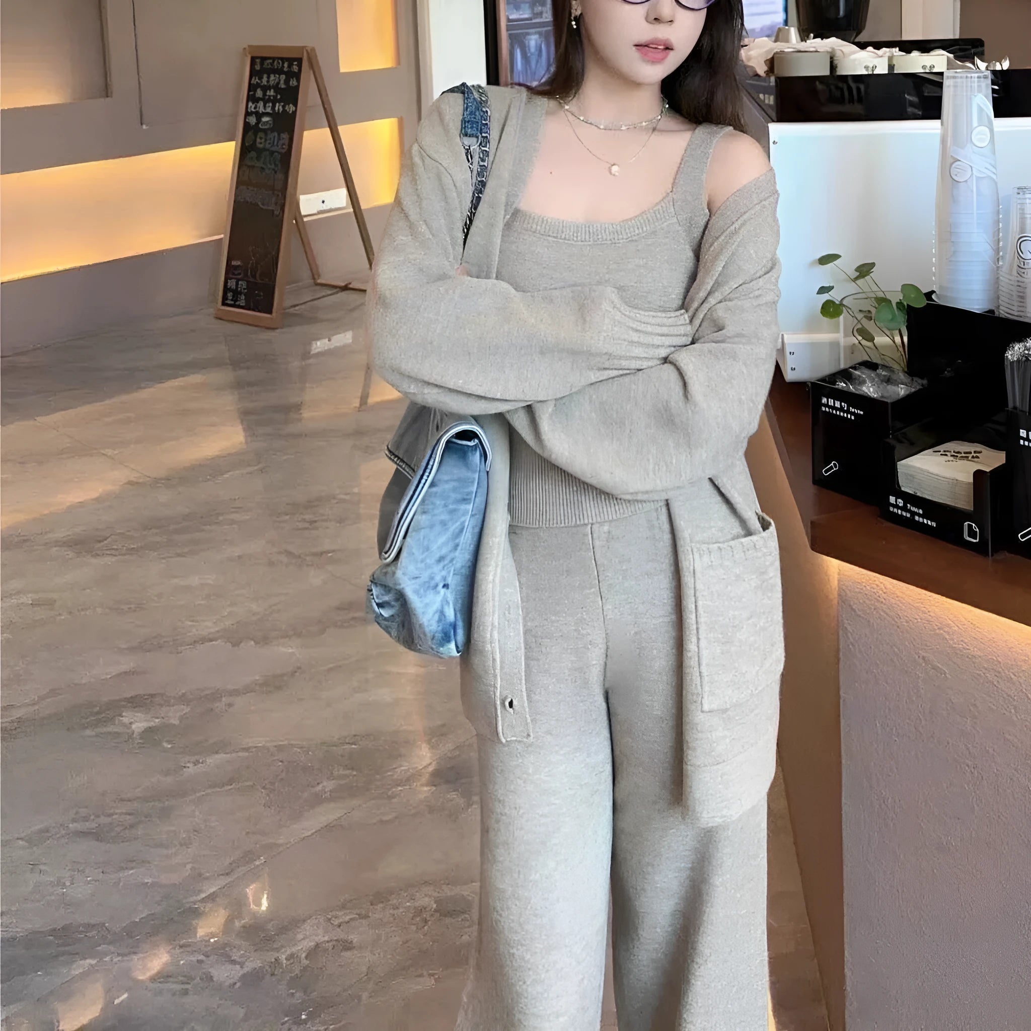 Women's light brown knit cardigan vest and suspender pants three-piece set laid flat