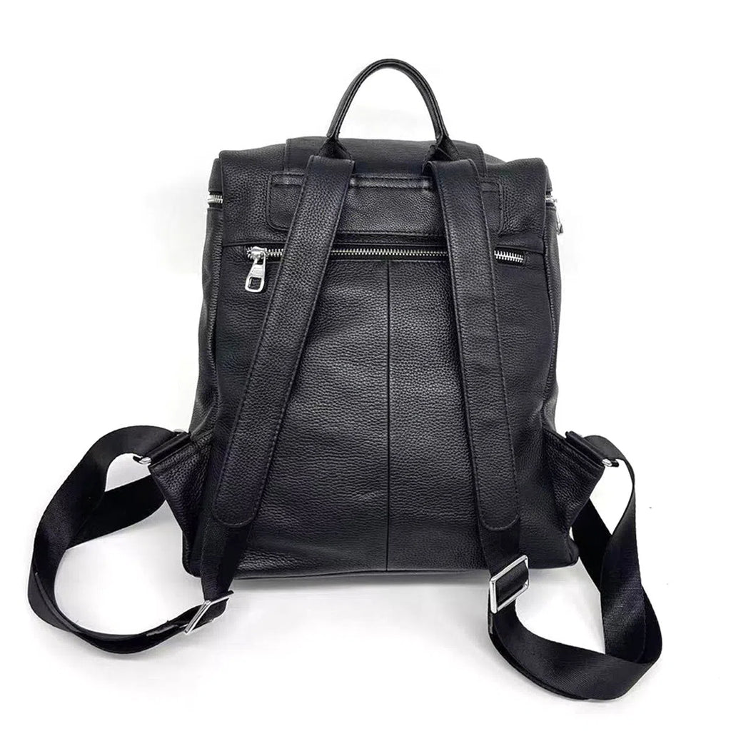 Black full-grain leather backpack, 30 x 13 x 35 cm, with curved shoulder straps and patchwork front