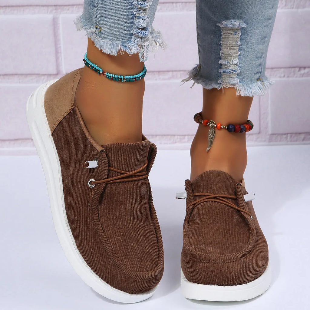 Women's flat shoes with breathable cloth upper, elastic band, low 1-3cm heel, round toe, in black brown or beige.