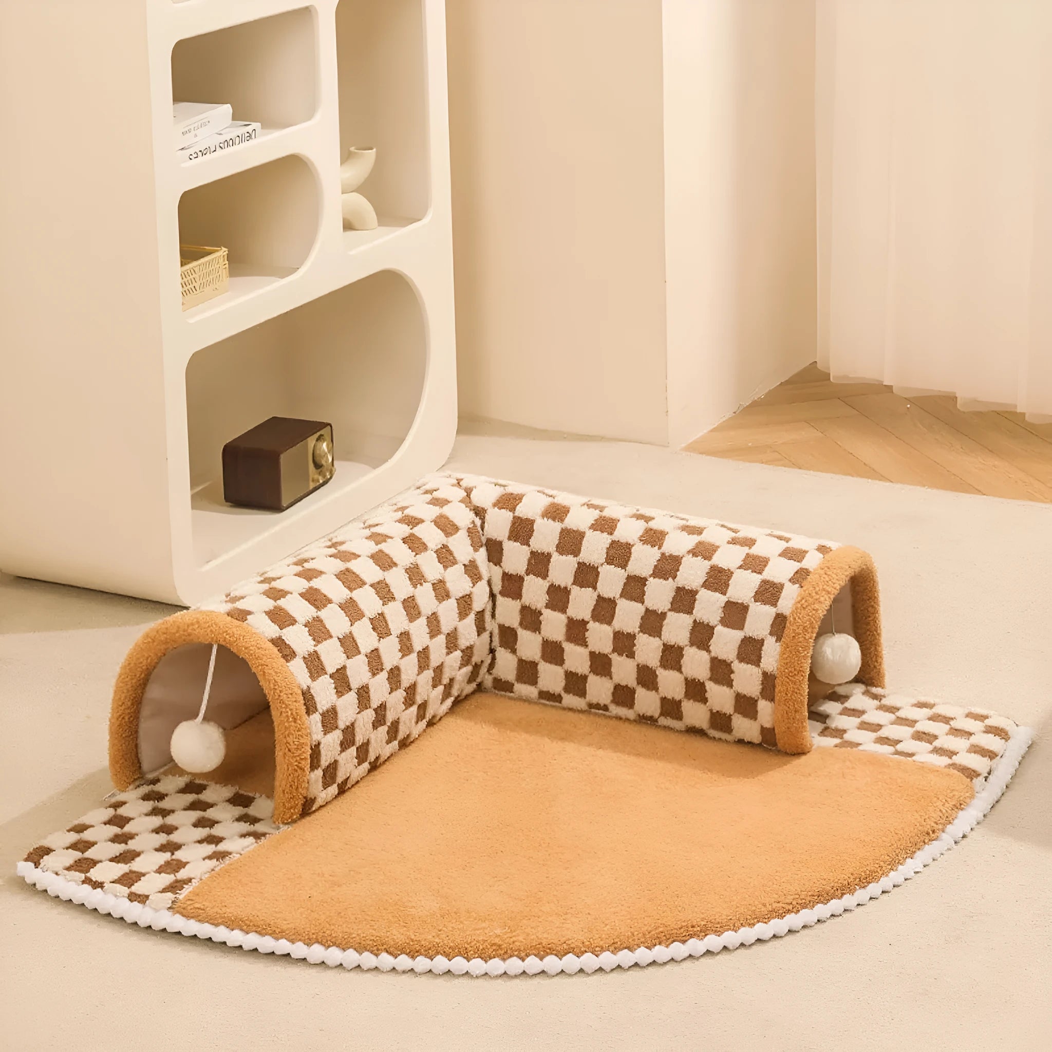 Coffee coloured plush dog and cat bed with integrated tunnel, shown in a fan-shaped plaid design