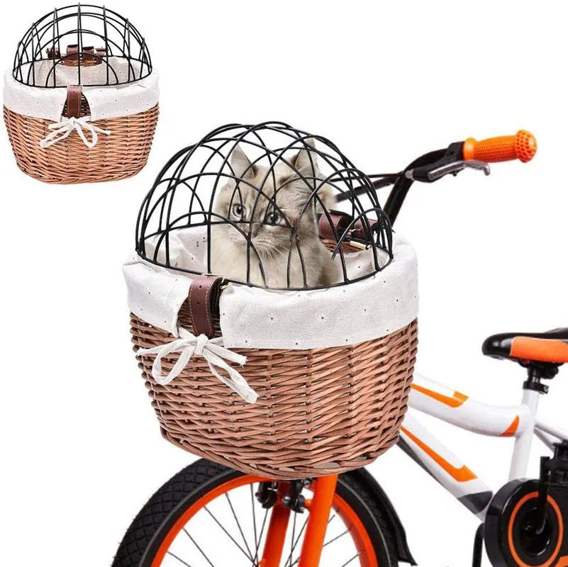 Medium honey-coloured wicker bicycle front basket for small cats and dogs on a road bike handlebar