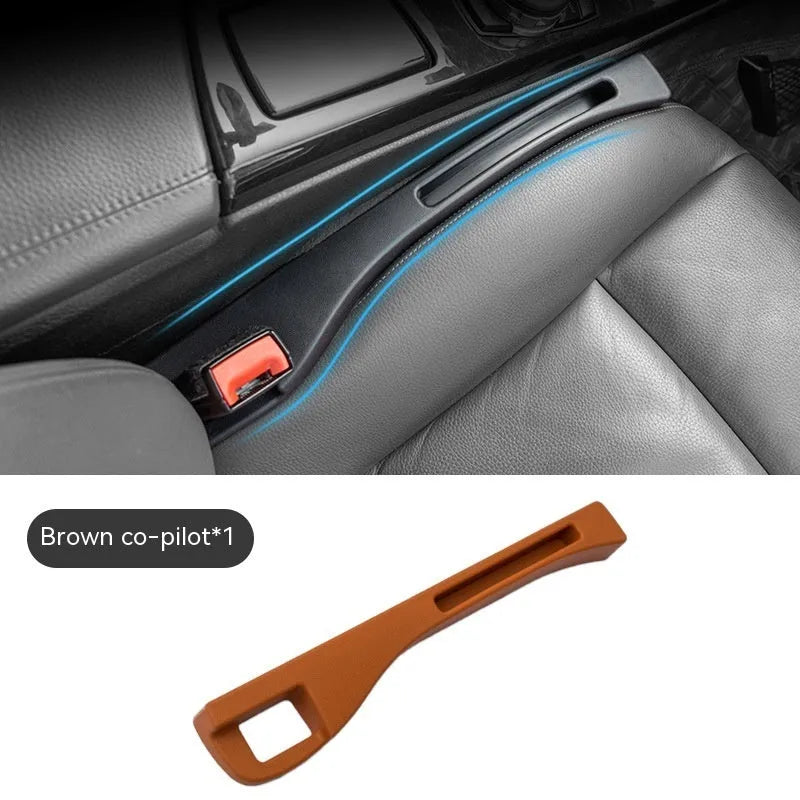 Black plastic car seat gap storage box organiser with handle between vehicle seats