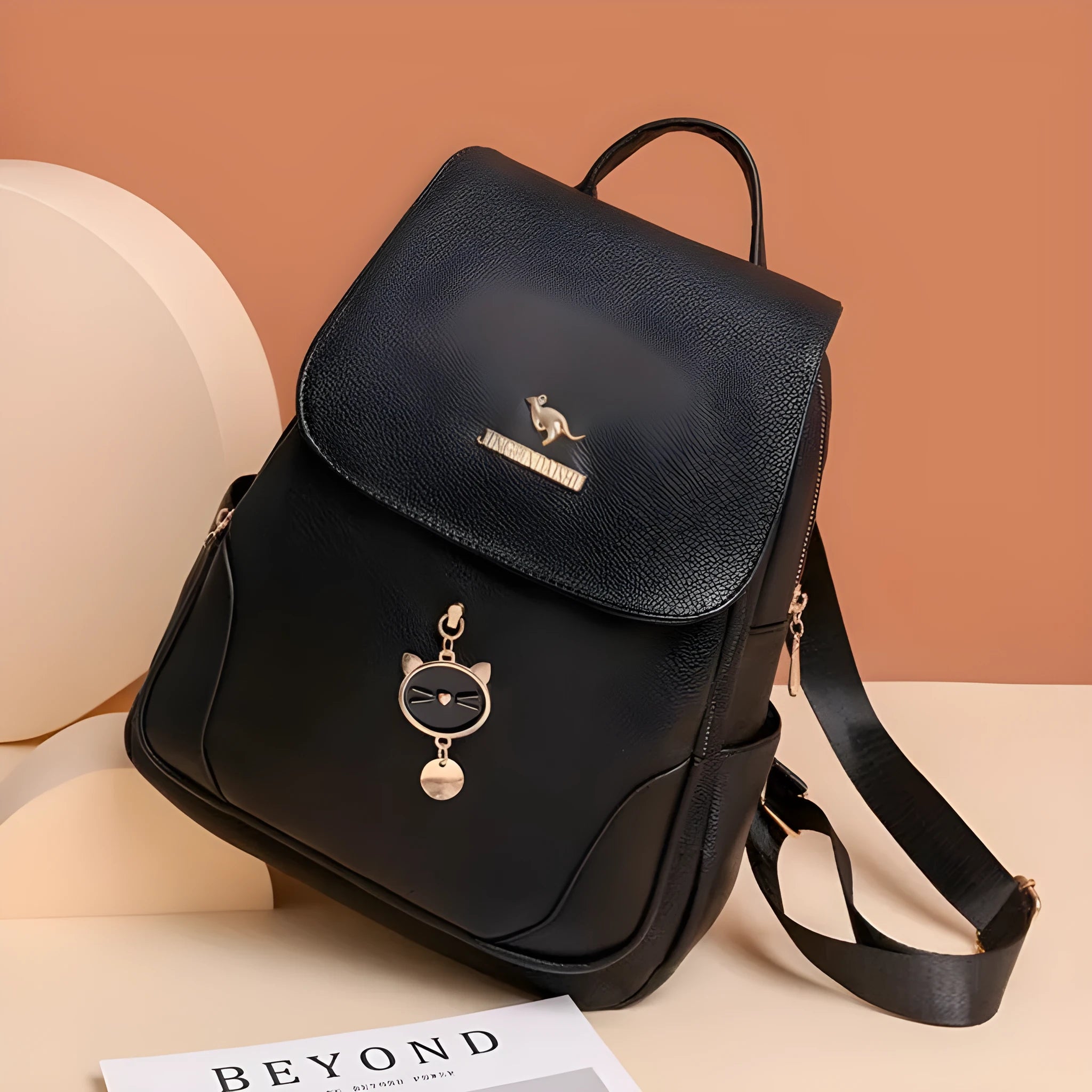 Casual black PU leather women's backpack with a three-dimensional front pocket.