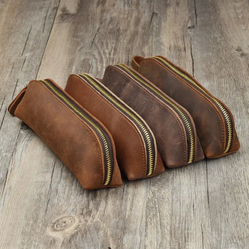 Black genuine leather pencil case with zipper closure measuring 18cm