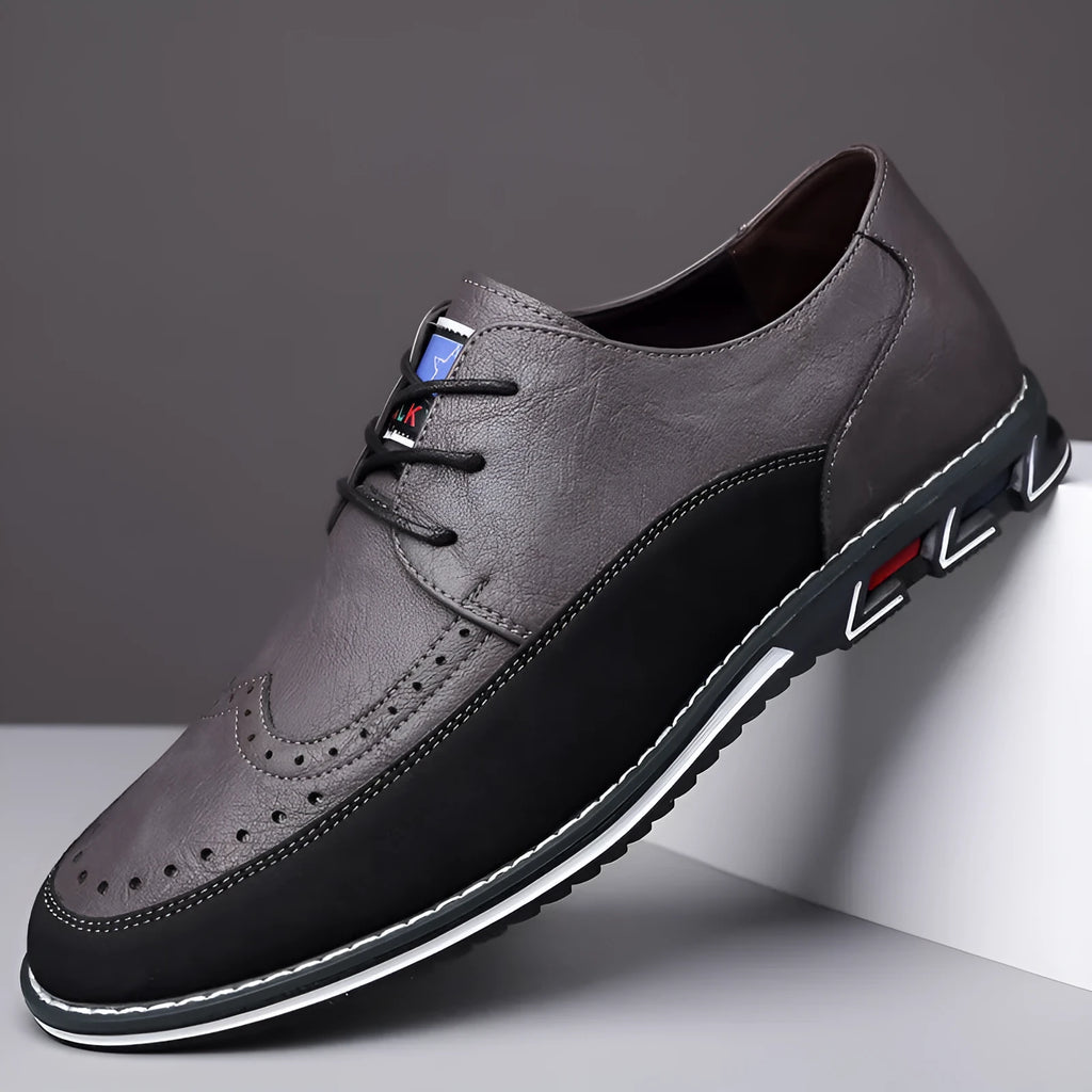 Men's black leather toe cap casual slip-on shoes with a rubber sole on a white background.