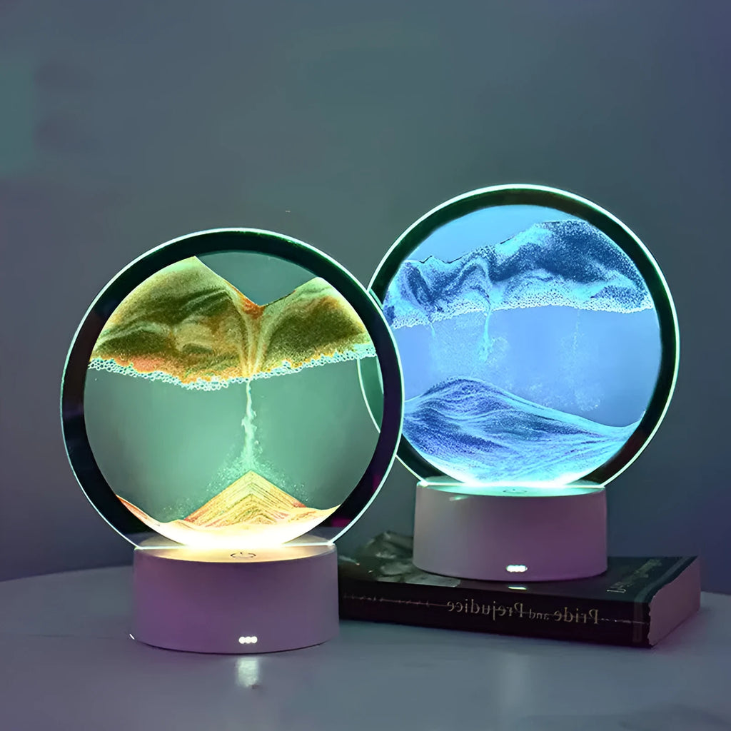Blue 3D quicksand touch table lamp with glass shade on a wooden desk.