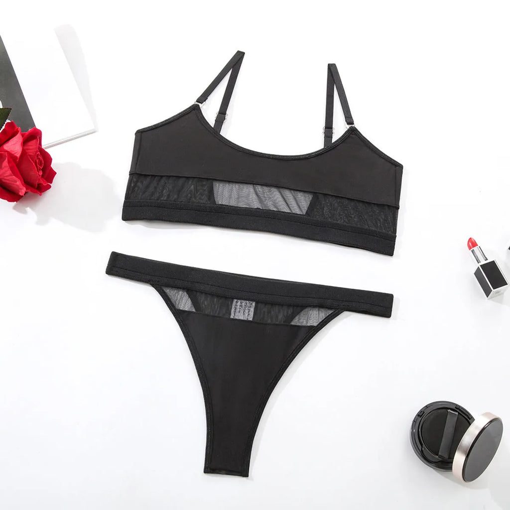 Women's black and white underwear set with full-cup bra and matching panties