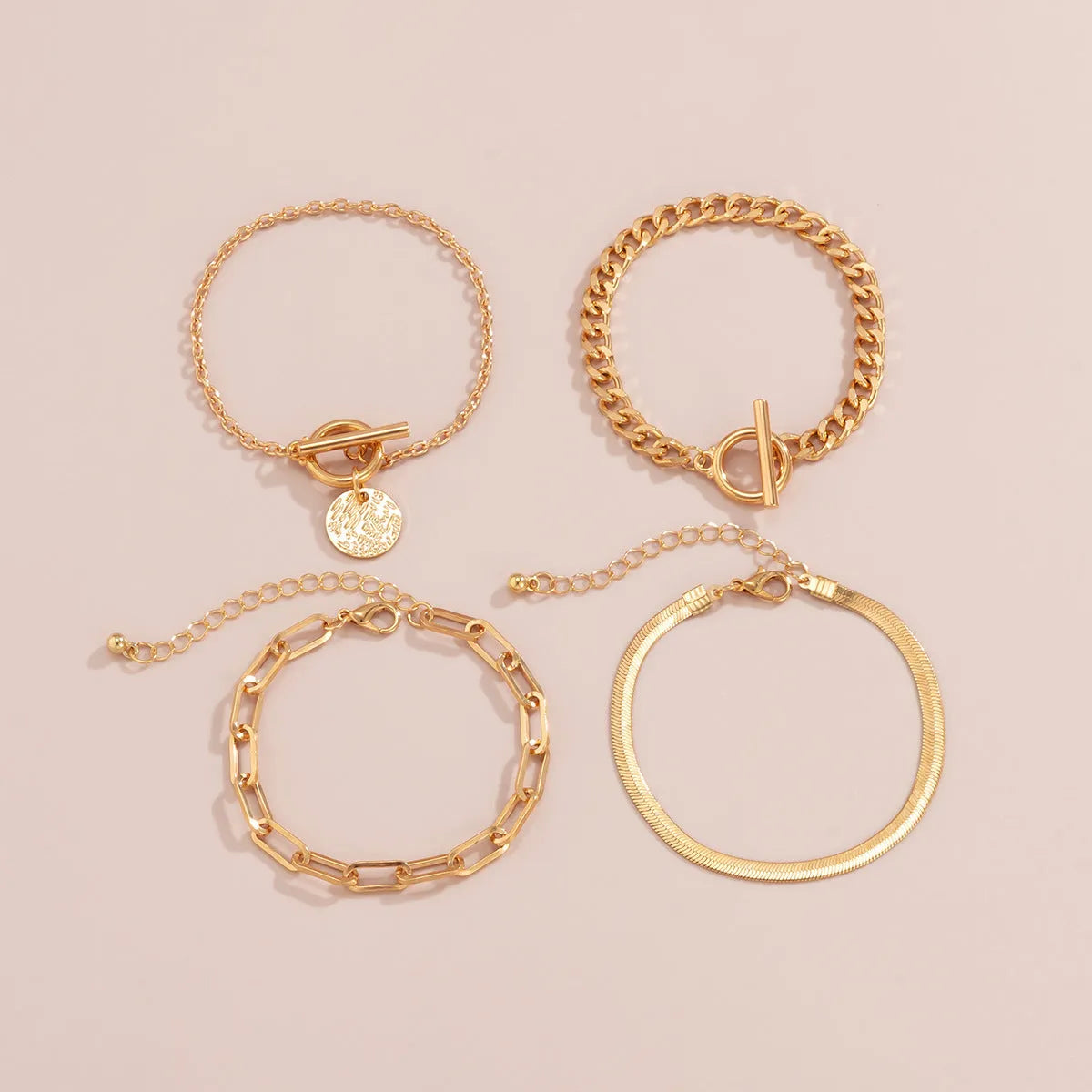 Set of 4 metal chain bracelets in gold or silver with snake bone and hollow chain designs
