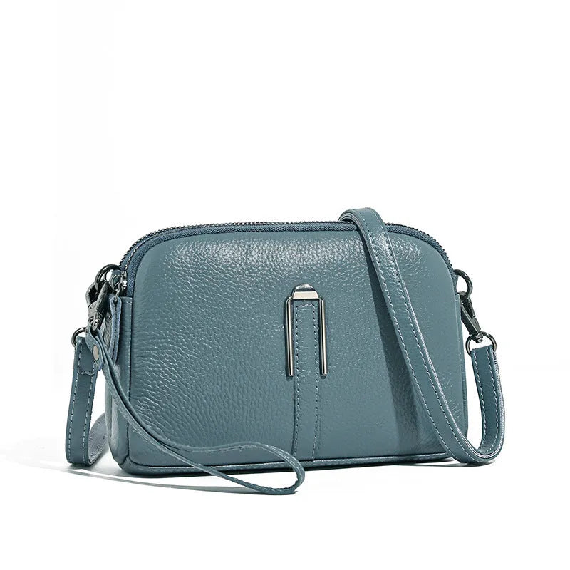 Minimalist crossbody bag in top-grain leather with spliced design, horizontal square shape, inner zippered pocket