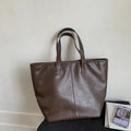 Large-capacity PU tote bag with double straps, 3D outer pocket, zip hidden pocket and phone pocket in black