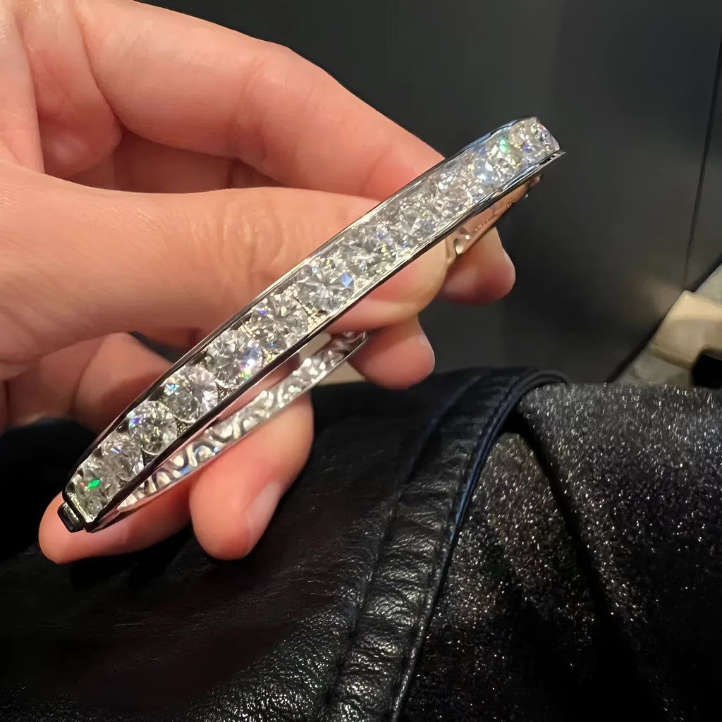 Mosan diamond bracelet with 40 point stone, 18K gold plated, silvery colour, original design, on white background