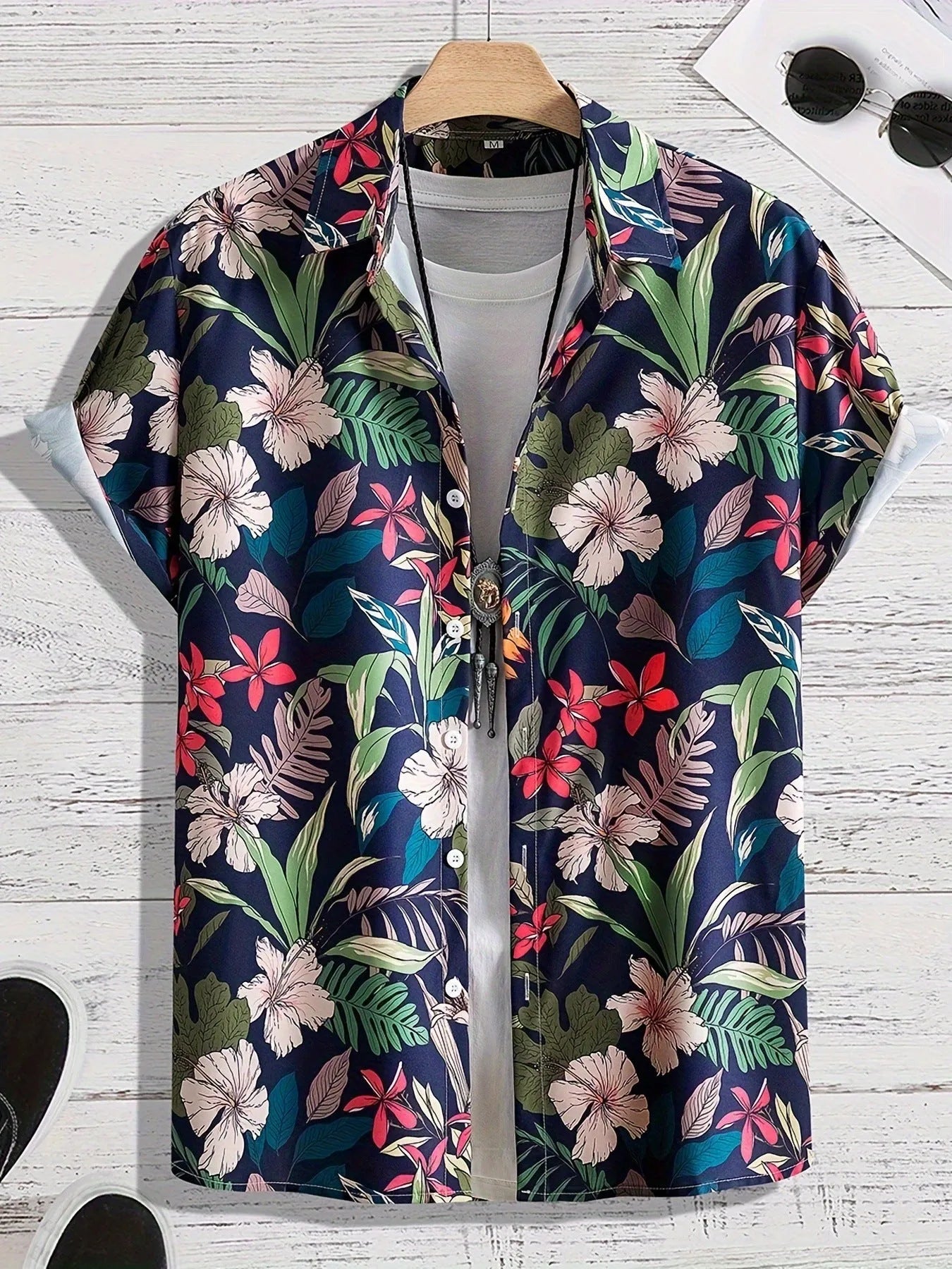 Man wearing loose fit floral print short sleeve shirt with cardigan style