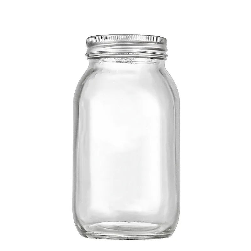 Set of six transparent 32oz glass bottles with airtight lids on a kitchen shelf