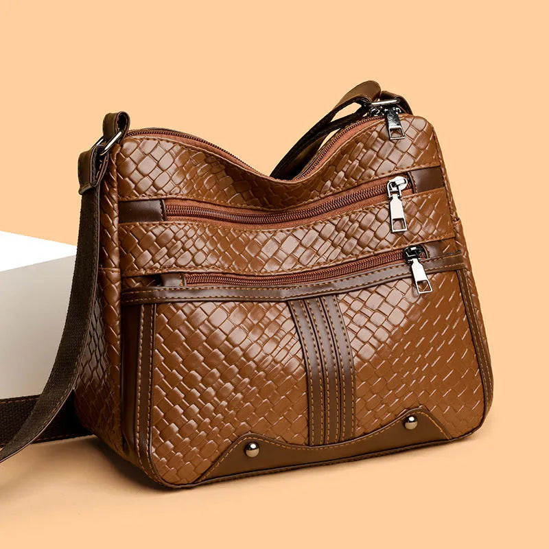 Woven PU messenger bag with multiple compartments showing zipper change bag section in brown colour