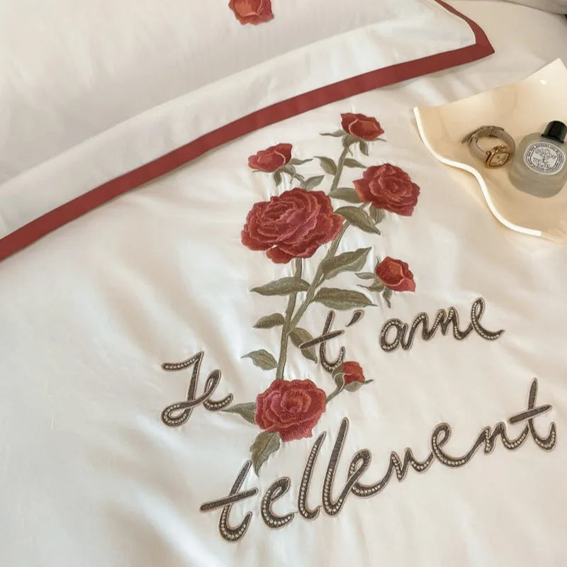 Cotton four-piece bedding set in solid colour with embroidery, includes quilt cover, bed sheet, and pillowcases