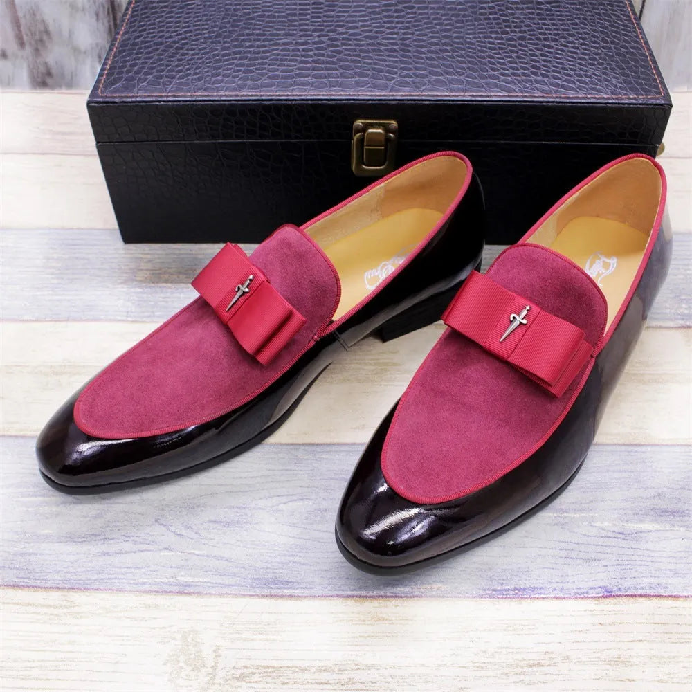 Men's glossy patent leather dress shoes with tassel detail in black, showing low-top design and leather toe holder.