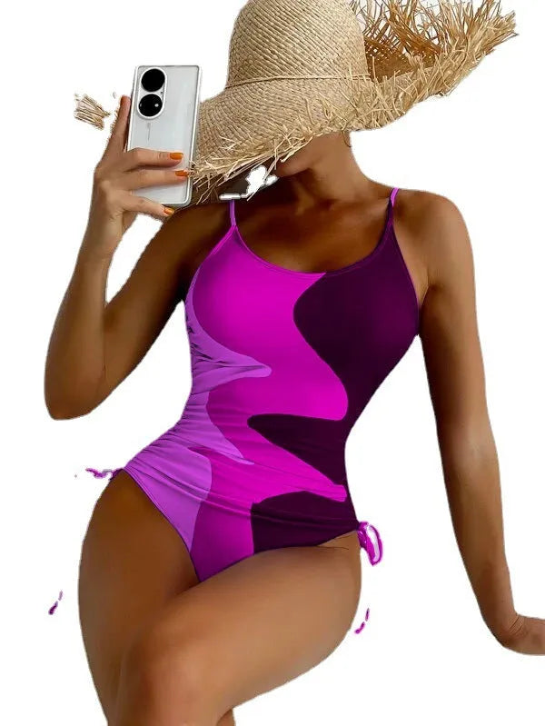 Women's blue sleeveless one-piece swimsuit with fixed swimming trunks on a white background.