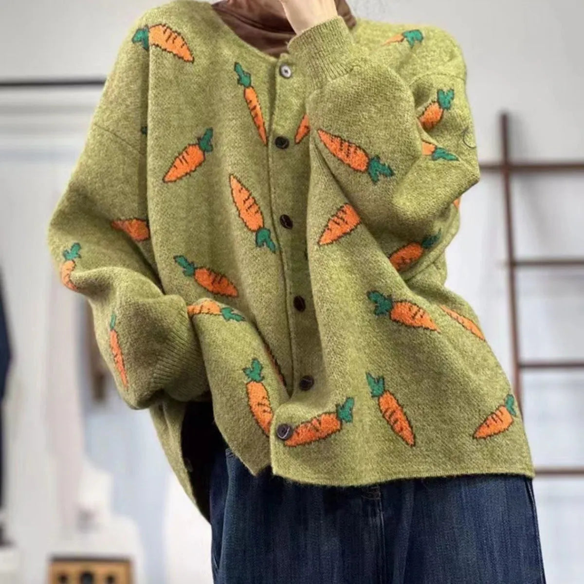 Round neck loose cardigan sweater with artistic colour contrast printing, made from viscose fibre.