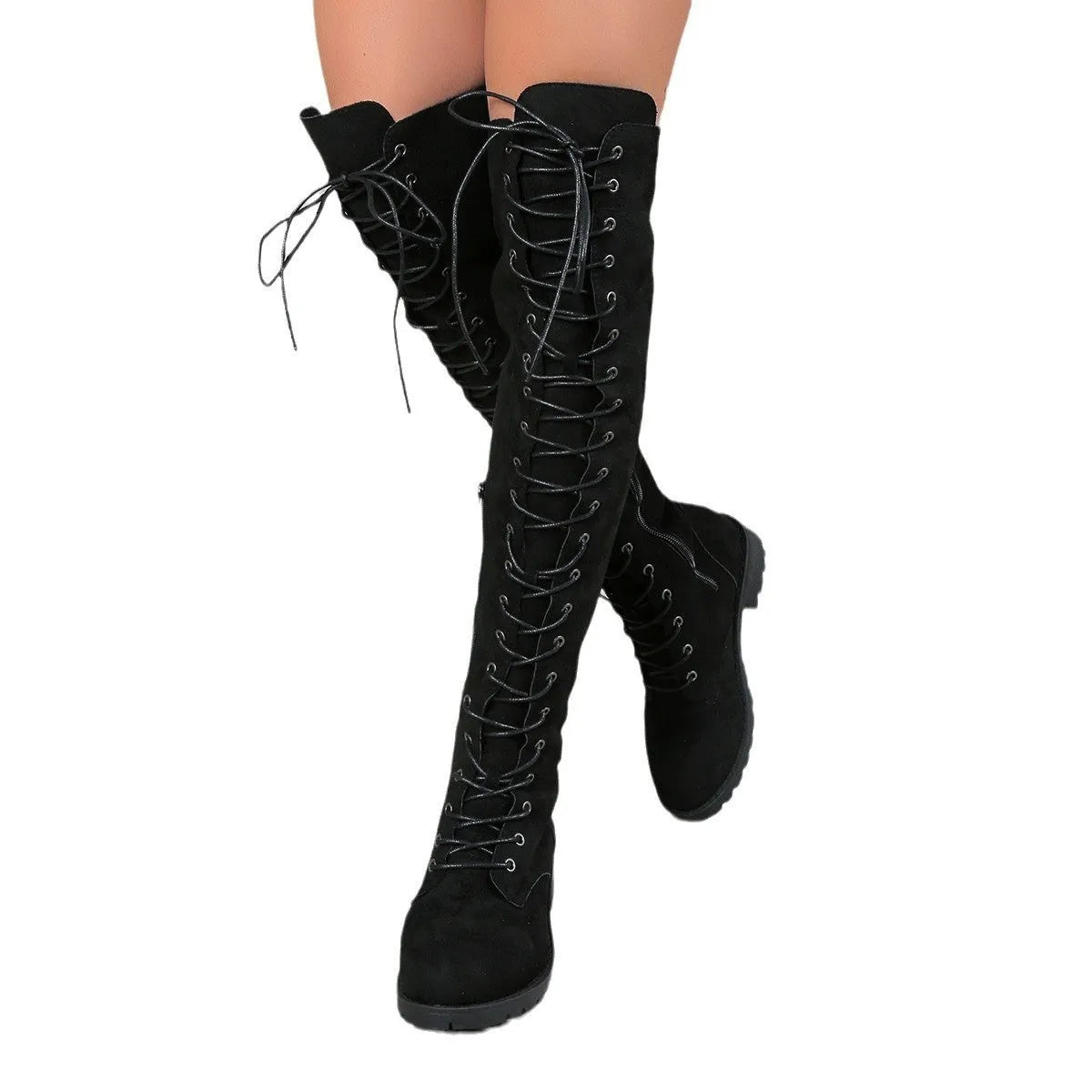 Black lace-up over the knee women's boots with a round toe and flat rubber sole on a plain background.