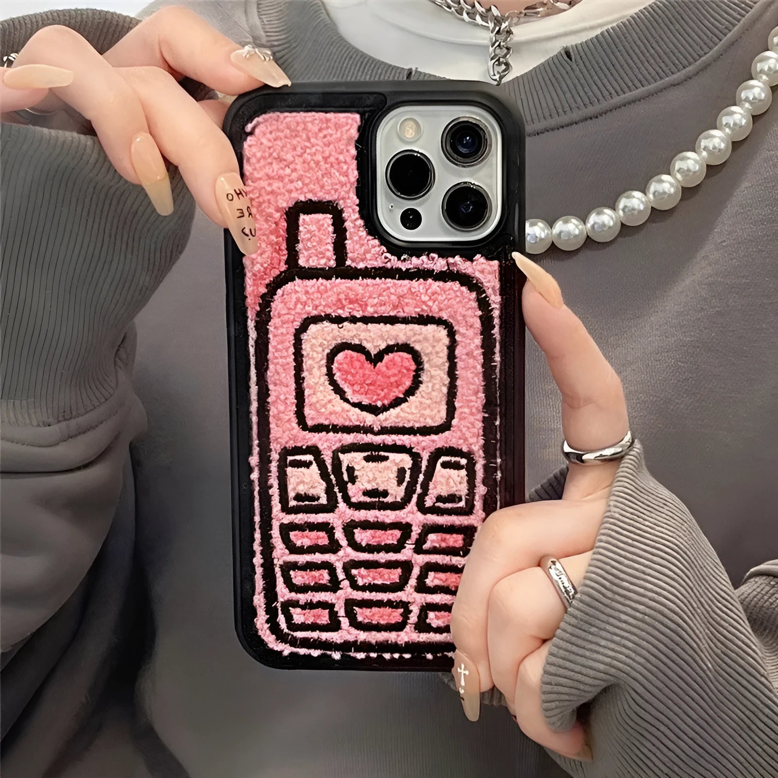Pink TPU iPhone case with embroidered towel fabric design on back cover