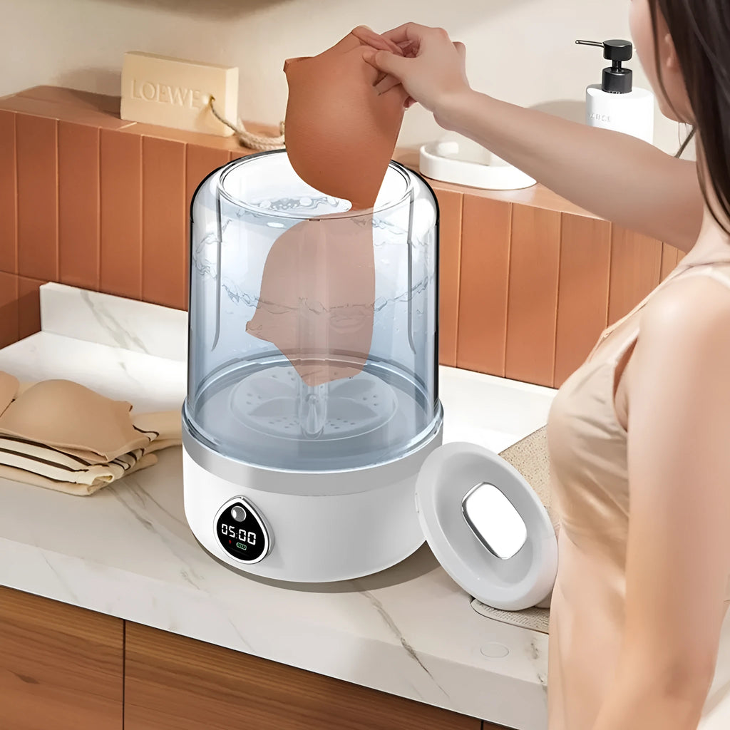 White and orange portable USB-powered mini washing machine with plastic waterproof construction