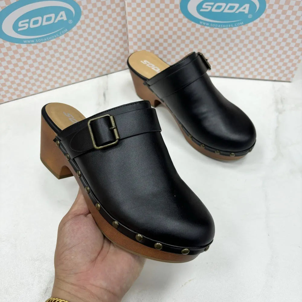 Black retro chunky heel slippers with metal rivet details on a microfibre upper and rubber sole.