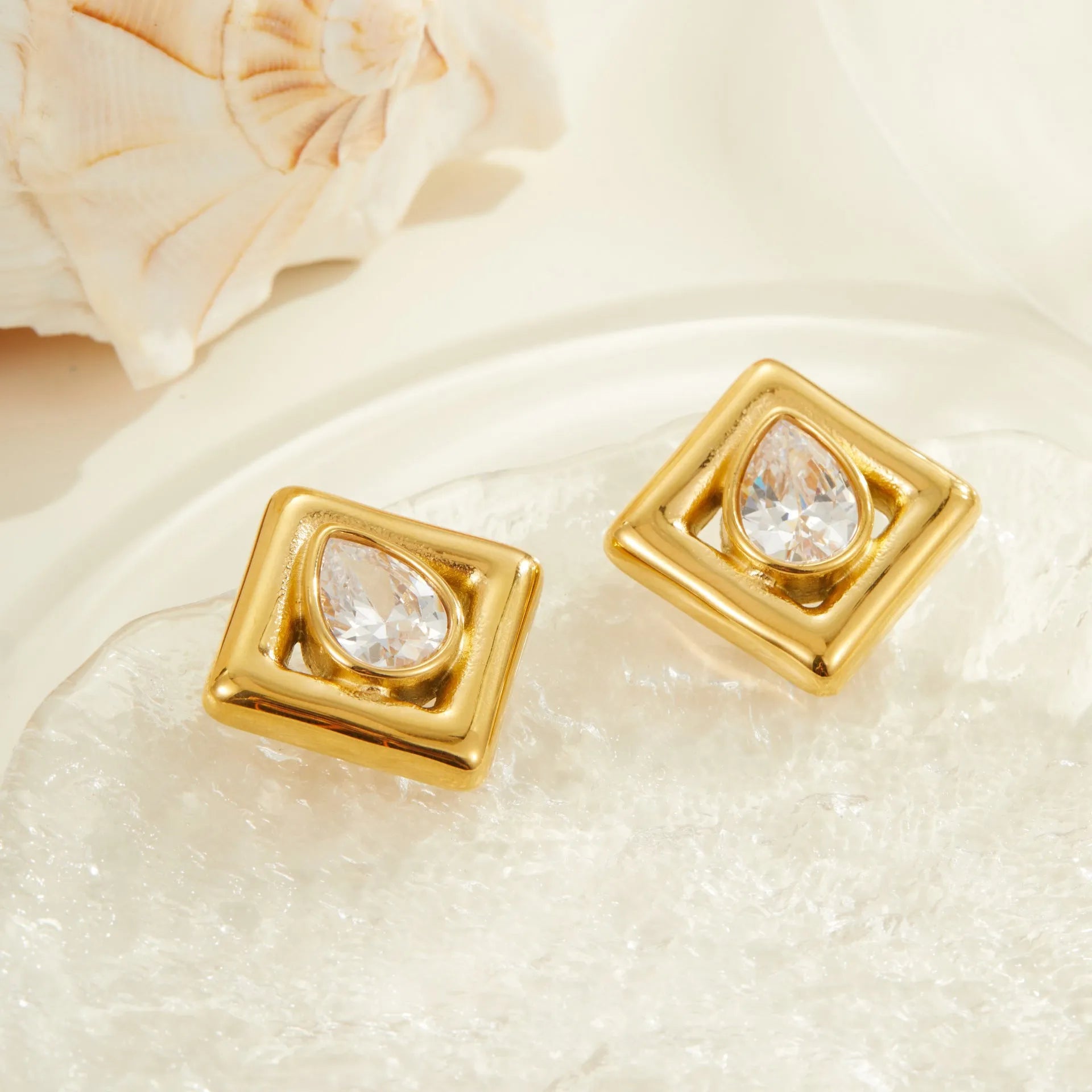 Gold geometric stud earrings with water drop zircon detail on stainless steel