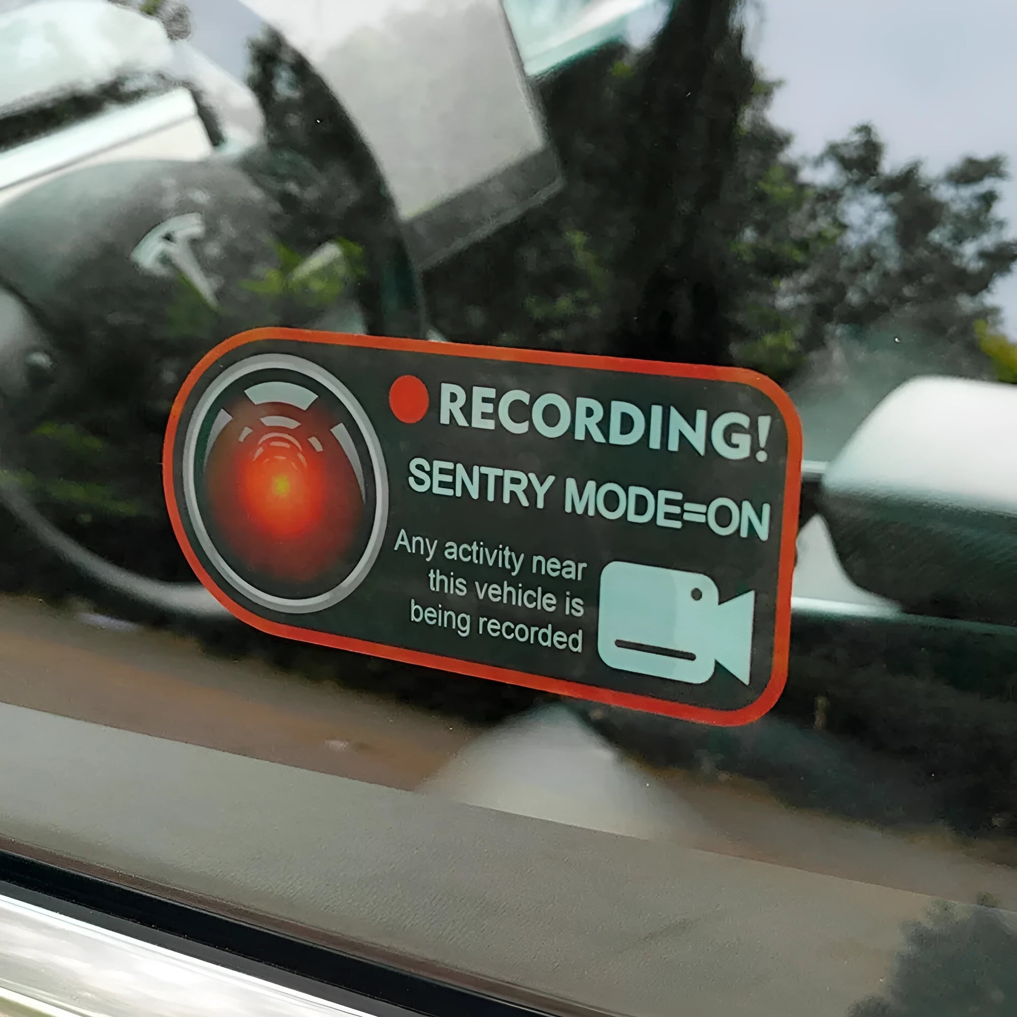 Tesla Sentry Mode electrostatic warning sticker measuring 11x5cm with English security text